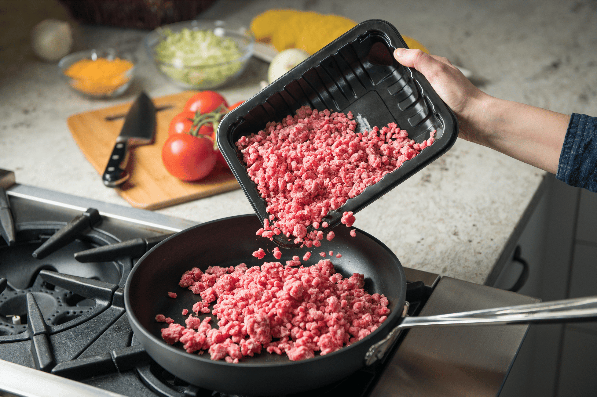 pouring ground beef